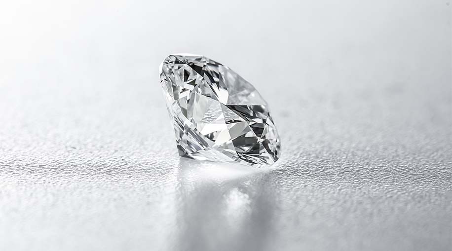A diamond on a silver surface.