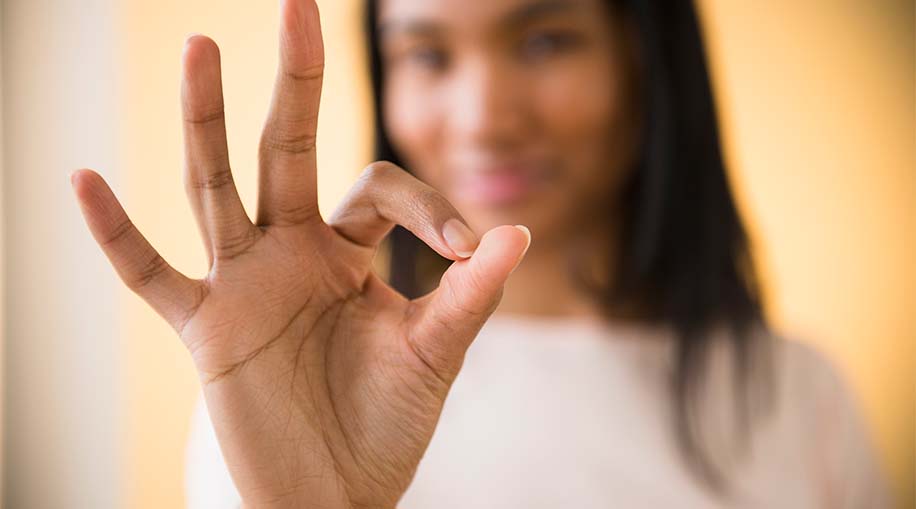 A person making the okay sign with their hand.